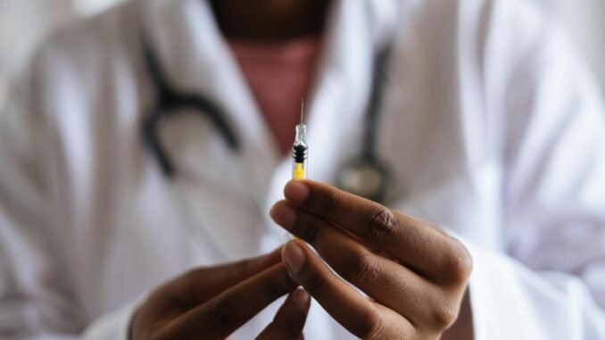 pexels-photo-3825529 person holding injection